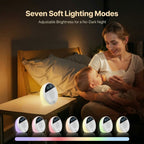 Woman and child in a bedroom with a night light displaying seven soft lighting modes. Deep Rest White Noise Machine