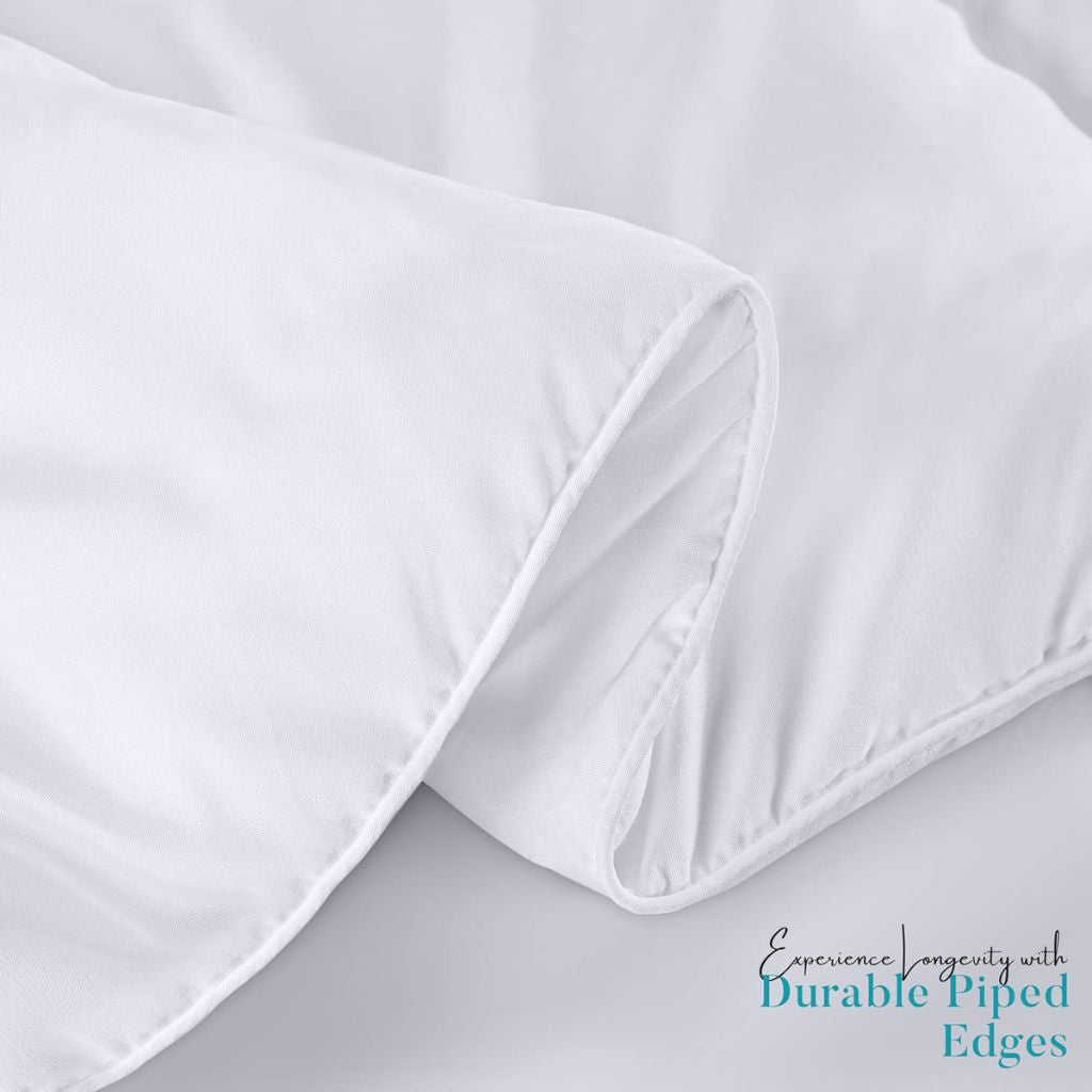 Close-up of white bed sheets with piped edges on a light gray background.