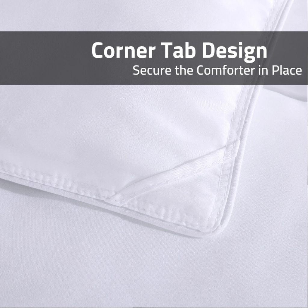 White comforter with corner tab design on a light gray background
