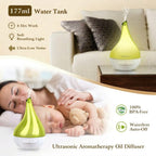 Ultrasonic aromatherapy oil diffuser on a nightstand with a woman and child sleeping in the background.