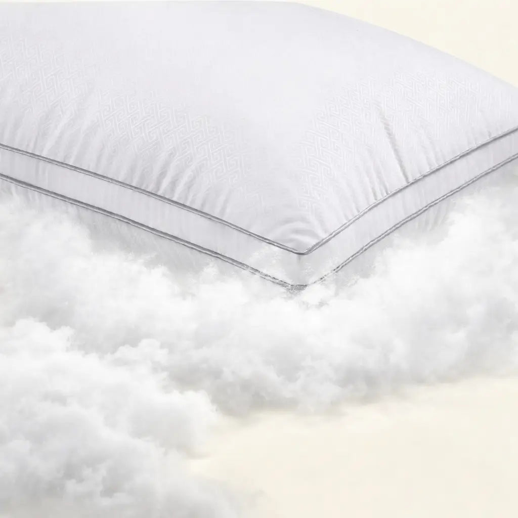 White pillow with a subtle pattern on a white background