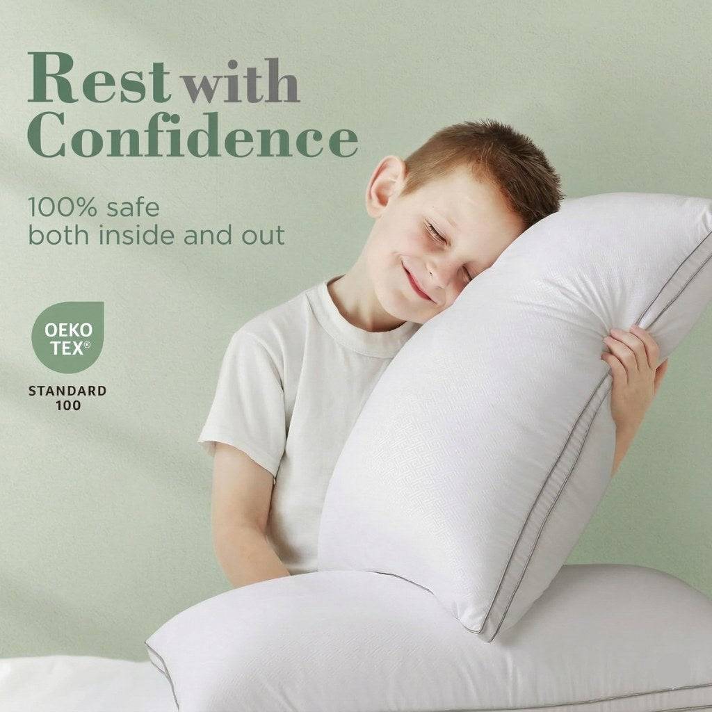 Child hugging a large pillow with 'Rest with Confidence' text and Oeko-Tex logo on a light green background