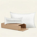 Two white textured Adjustable pillows with a cardboard box on a beige background
