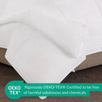 White fabric on a brown surface with OEKO-TEX certification label.