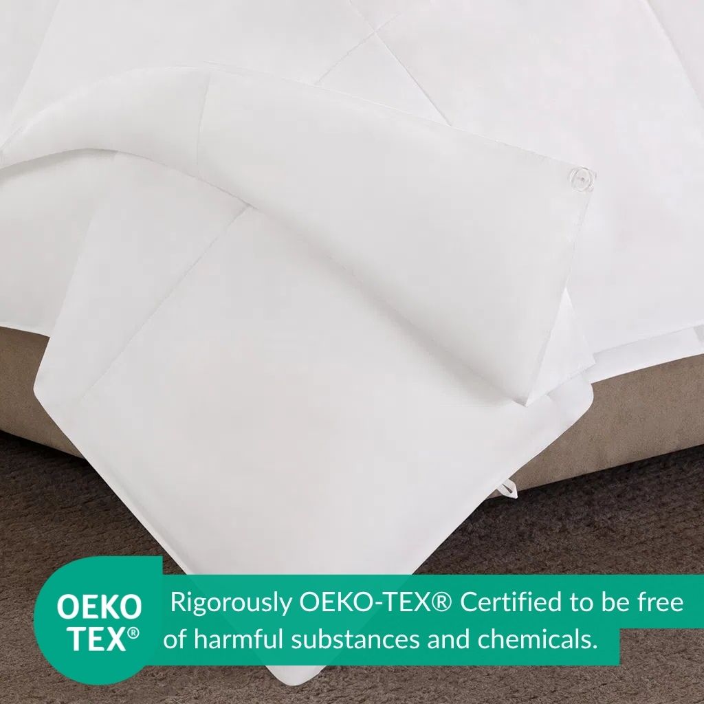 White fabric on a brown surface with OEKO-TEX certification label.