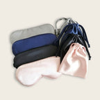 Set of silk sleep masks in various colors on a light background