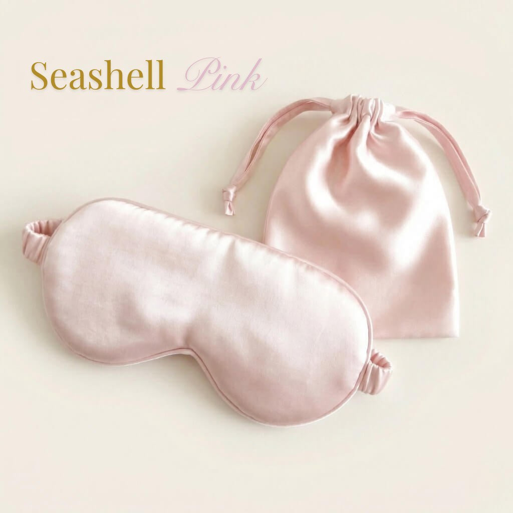 Pink satin eye mask and pouch on a light beige background with 'Seashell Pink' text.