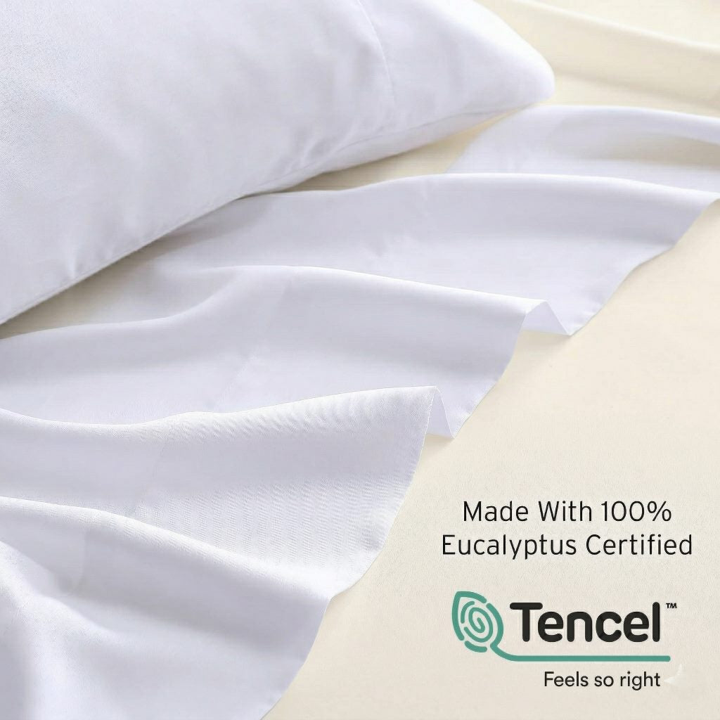 White bedding with Tencel logo and text on a pillow